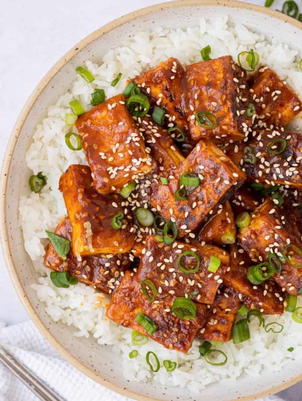 <p>Christie at Home</p><p>Fried tofu smothered in a delicious, spicy saucy gochujang based sauce with a hint of sesame. This vegan gochujang Korean tofu is quick to make in under 30 minutes or less and is fantastic for lunch or dinner.</p><p><strong>Get the recipe: <a href="https://christieathome.com/blog/spicy-gochujang-sesame-tofu/" rel="nofollow noopener" target="_blank" data-ylk="slk:Spicy Gochujang Sesame Tofu;elm:context_link;itc:0;sec:content-canvas" class="link "><em>Spicy Gochujang Sesame Tofu</em></a></strong></p>