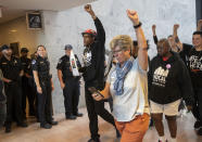 Protesters opposed to President Donald Trump's Supreme Court nominee, Brett Kavanaugh, demonstrate in the Hart Senate Office Building on Capitol Hill in Washington, Thursday, Sept. 20, 2018. (AP Photo/J. Scott Applewhite)