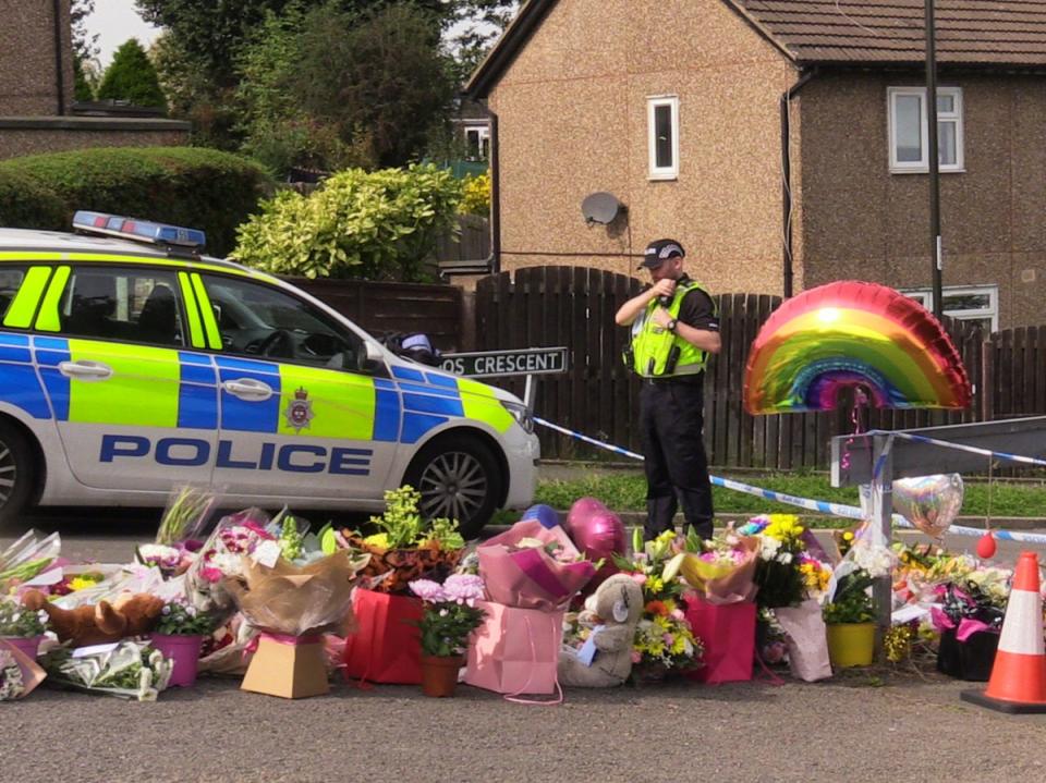 Flowers near to the murder scene in Chandos Crescent (PA)