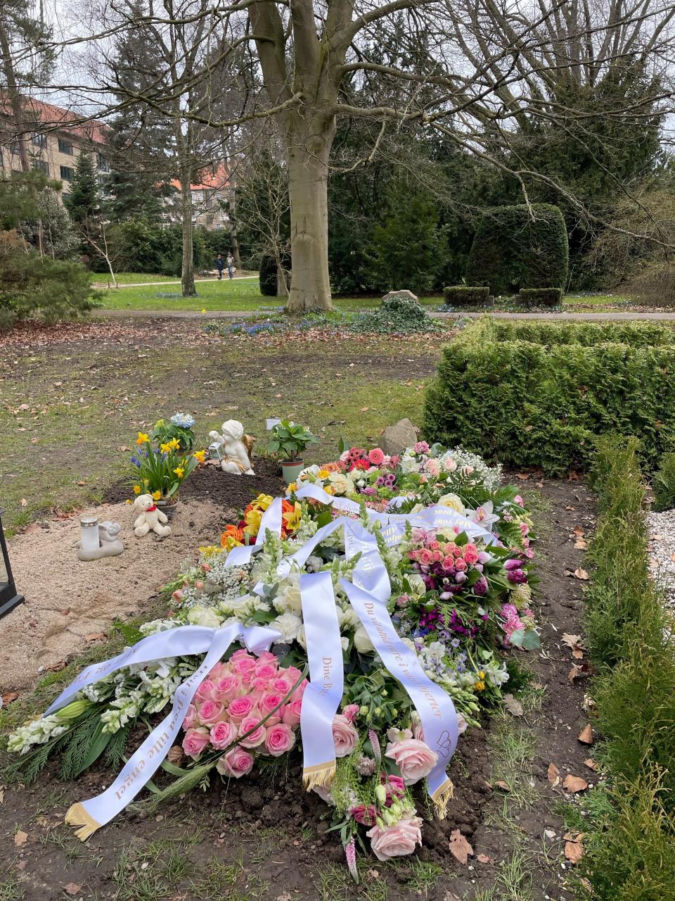 Flowers adorn the grave of Alissa Feldborg who died of an ultra-rare disease two years after receiving gene therapy to hopefully change its course.