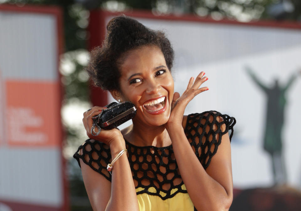 File - Model Denny Mendez poses for photographers on the red carpet for the film La Jalousie at the Venice Film Festival. The 77th Venice Film Festival will kick off on Wednesday, Sept. 2, 2020, but this year's edition will be unlike any others. Coronavirus restrictions will mean fewer Hollywood stars, no crowds interacting with actors and other virus safeguards will be deployed. (AP Photo/Andrew Medichini, File)