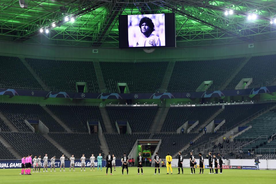 Players observe a minute of silence for former Argentina soccer great Diego Armando Maradona before the Champions League, Group B, soccer match between Borussia Moenchengladbach and Shakhtar Donetsk at the Borussia Park in Moenchengladbach, Germany, Wednesday, Nov. 25, 2020. (AP Photo/Martin Meissner)