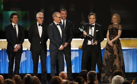 Mark Ruffalo (2nd R) accepts the award for his fellow cast members for Outstanding Performance by a Cast in a Motion Picture for the film "Spotlight" at the 22nd Screen Actors Guild Awards in Los Angeles, California January 30, 2016. REUTERS/Lucy Nicholson