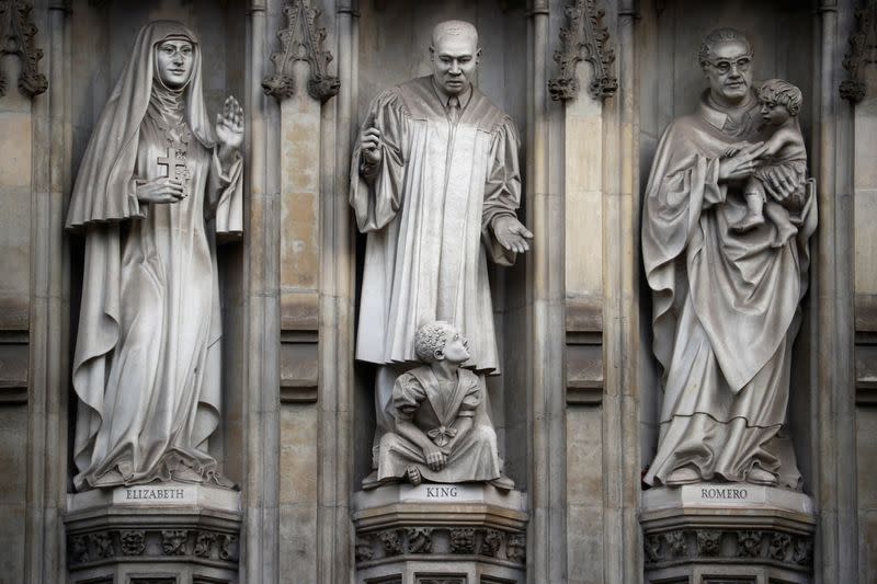 Stone carvings of figures are seen on the outside of Westminster Abbey in London