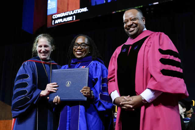 Supreme Court Associate Justice Ketanji Brown Jackson receives an honorary degree from American University President Sylvia Burwell, left, and American University Washington College of Law Dean Roger Fairfax at the commencement ceremony for American's Washington College of Law, Saturday, May 20, 2023, in Washington. (AP Photo/Patrick Semansky)