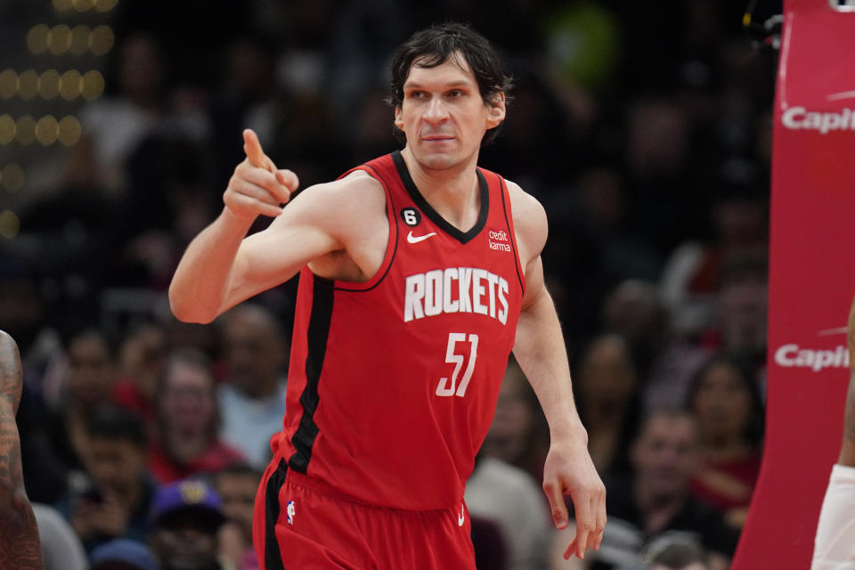 Houston Rockets center Boban Marjanovic (51) reacts after scoring against the Washington Wizards during the first half of an NBA basketball game, Sunday, April 9, 2023, in Washington. (AP Photo/Jess Rapfogel)