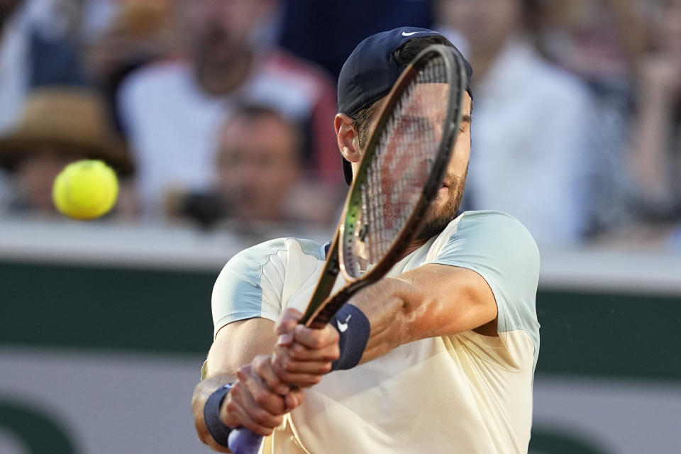 Russia's Karen Khachanov plays a shot against Britain's Cameron Norrie during their third round match at the French Open tennis tournament in Roland Garros stadium in Paris, France, Friday, May 27, 2022. (AP Photo/Michel Euler)