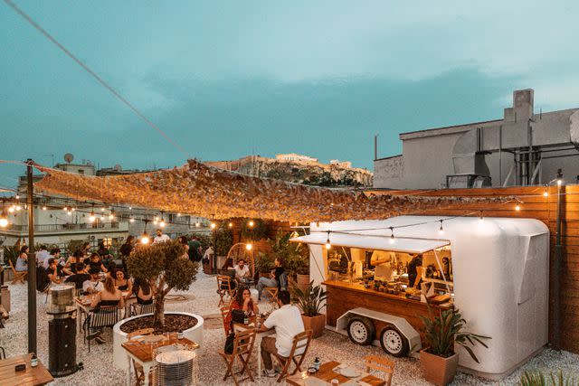 <p>Courtesy of Ergon House</p> Acropolis views from RetirÃ© Bar on the rooftop of the Ergon House hotel