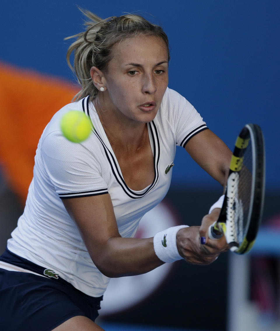 Ukraine's Lesia Tsurenko hits a return to Denmark's Caroline Wozniacki during their third round match at the Australian Open tennis championship in Melbourne, Australia, Saturday, Jan. 19, 2013.