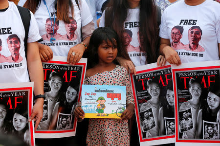 FILE PHOTO: Activists gather for a rally to call for the release of imprisoned Reuters journalists Wa Lone and Kyaw Soe Oo, one year after they were arrested, in Yangon, Myanmar December 12, 2018. REUTERS/Myat Thu Kyaw/File Photo