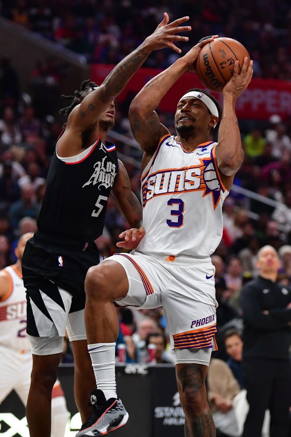 Phoenix Suns guard Bradley Beal (3) moves to the basket against Los Angeles Clippers guard Bones Hyland (5) during the second half at Crypto.com Arena in Los Angeles on April 10, 2024.