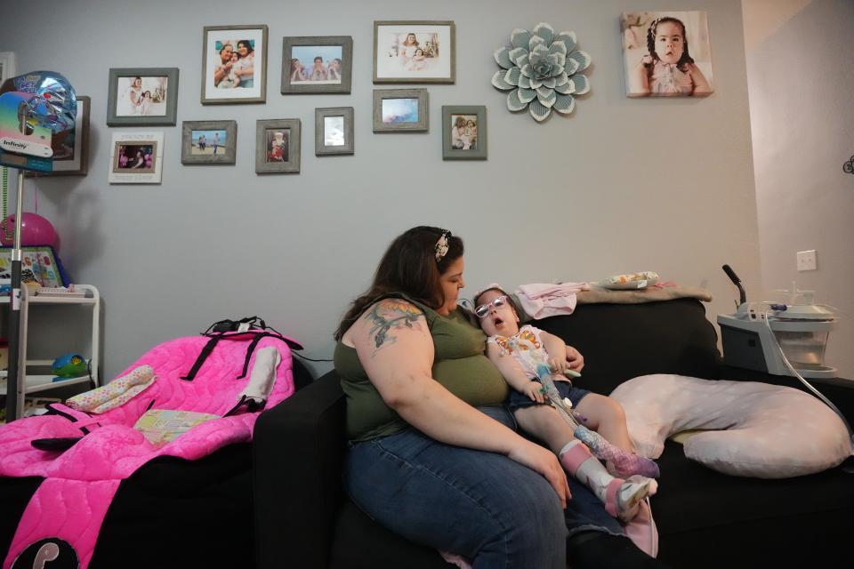 Natalia Castillo holds her daughter Mariana at their home Nov. 9 in Kyle. Through Season for Caring last year, the family received new furniture and had their home remodeled with accessible bathrooms and better flooring for Mariana's wheelchair. Mariana was born prematurely and has a rare neuromuscular disease that requires her to be on a ventilator and use a wheelchair.