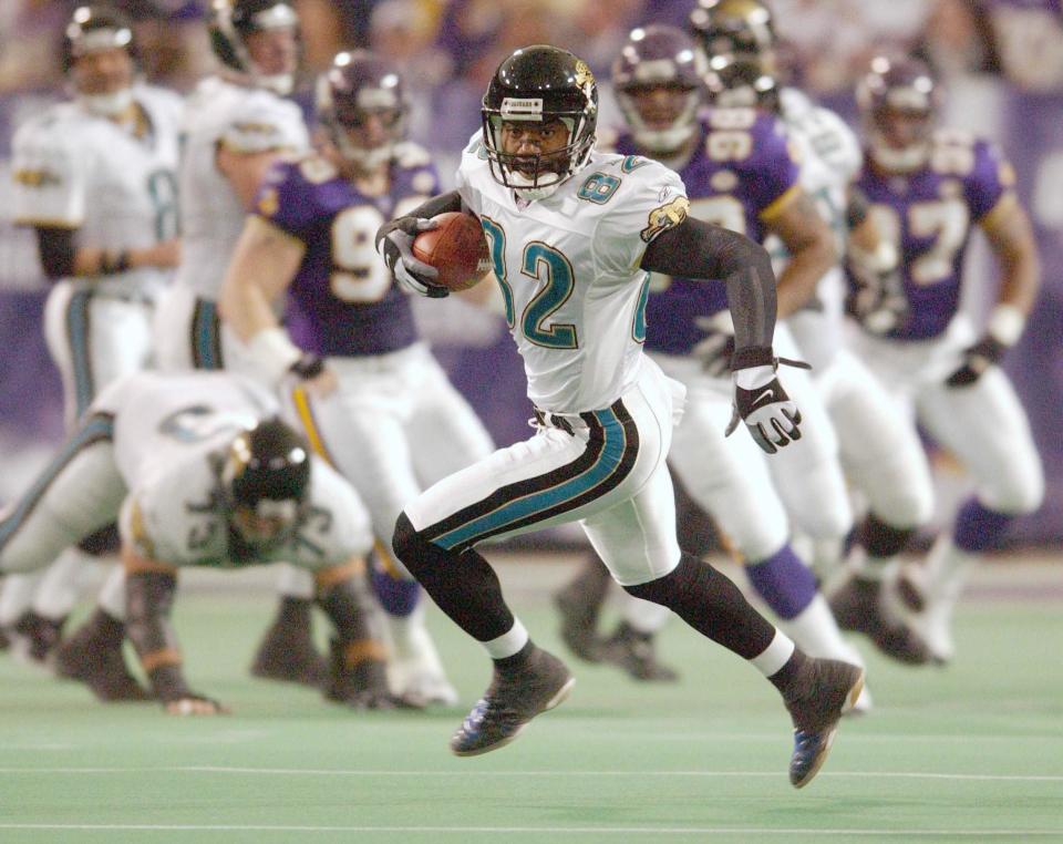 Jacksonville Jaguars receiver Jimmy Smith scampers away from the Minnesota Vikings defense on Dec. 23, 2001.