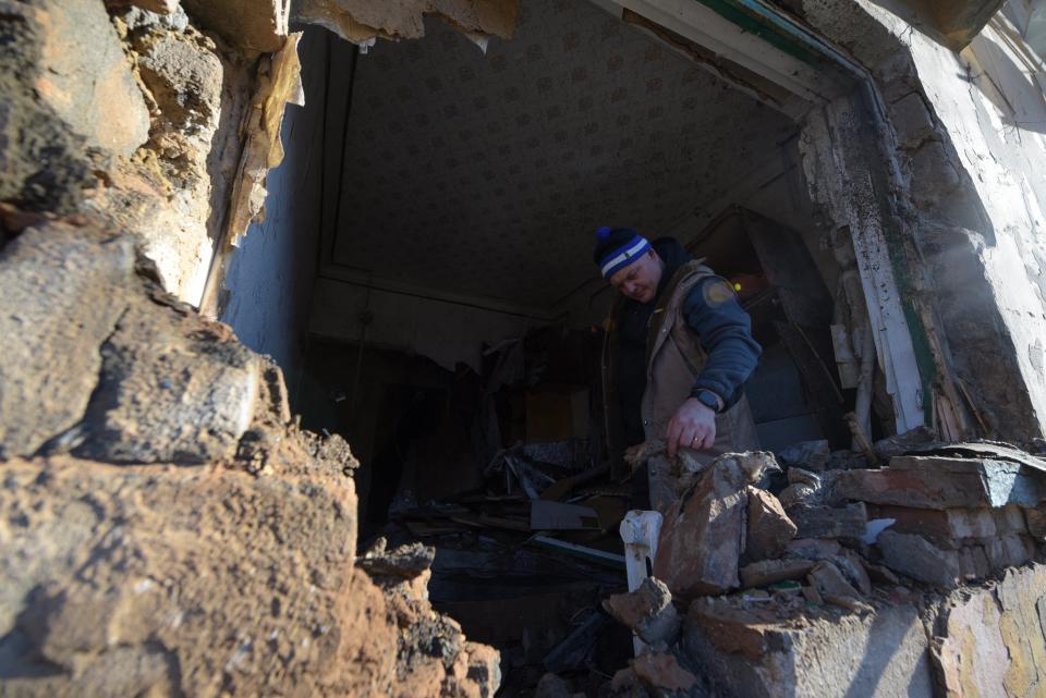 A local resident inspects his flat damaged by recent shelling in Donetsk, Russian-controlled Ukraine (AFP via Getty Images)