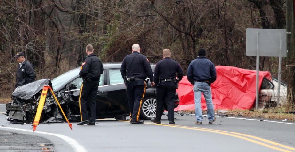 Hillsborough police investigate a fatal head-on collision, Sunday, Jan. 4, 2015, on Millstone River Road.