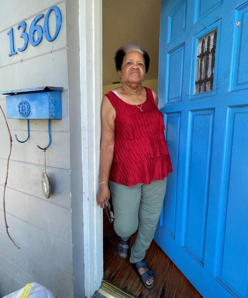 Barbara Fuller, a River Park resident, stands in the doorway of her home after Hurricane Ian on Saturday, Oct. 1, 2022. Her home flooded during a storm surge caused by Hurricane Ian on Wednesday, Sept. 28.