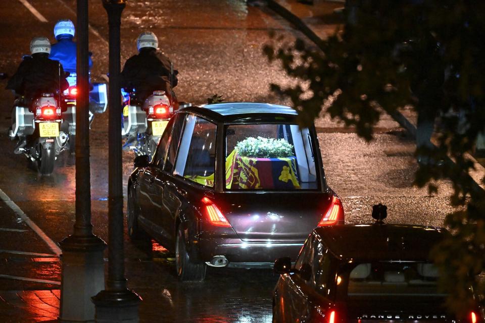 Seen from the top of the Wellington Arch, the coffin of Queen Elizabeth II is taken in the Royal Hearse to Buckingham Palace in London on September 13, 2022, following her death on September 8.