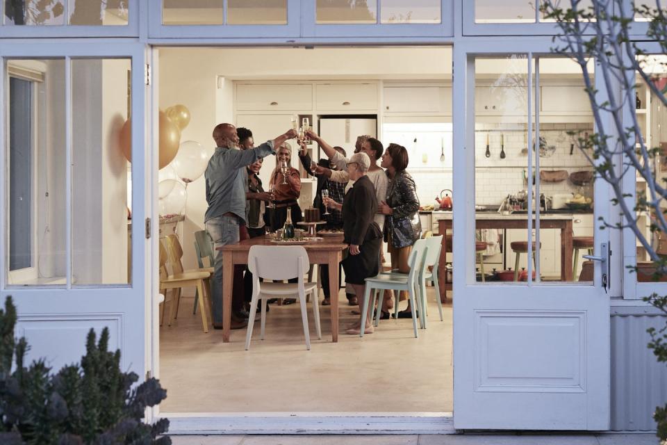 <span class="caption">Quaranteams are founded on the idea that people can interact freely within a group, but that group stays isolated from other people as much as possible.</span> <span class="attribution"><a class="link " href="https://www.gettyimages.com/detail/photo/family-toasting-drinks-during-birthday-party-royalty-free-image/1187298454?adppopup=true" rel="nofollow noopener" target="_blank" data-ylk="slk:Klaus Vedfelt/Digital Vision via Getty Images;elm:context_link;itc:0;sec:content-canvas">Klaus Vedfelt/Digital Vision via Getty Images</a></span>