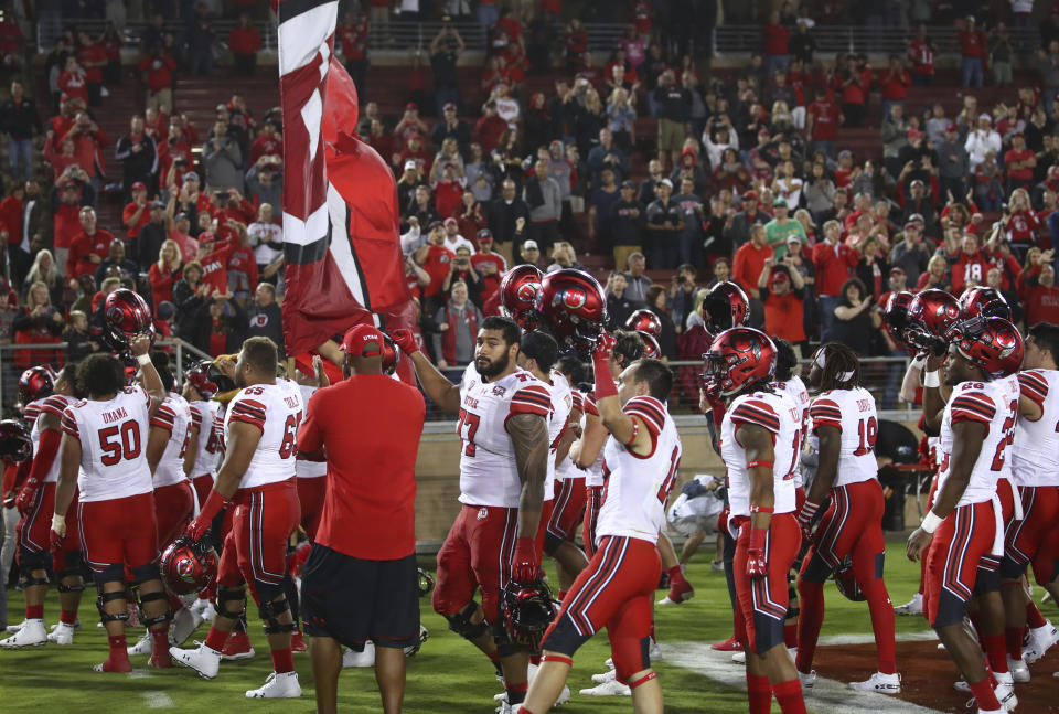 Utah celebrates with fans at the end of an NCAA college football game against Stanford Saturday, Oct. 6, 2018, in Stanford, Calif. Utah won, 40-21. (AP Photo/Ben Margot)