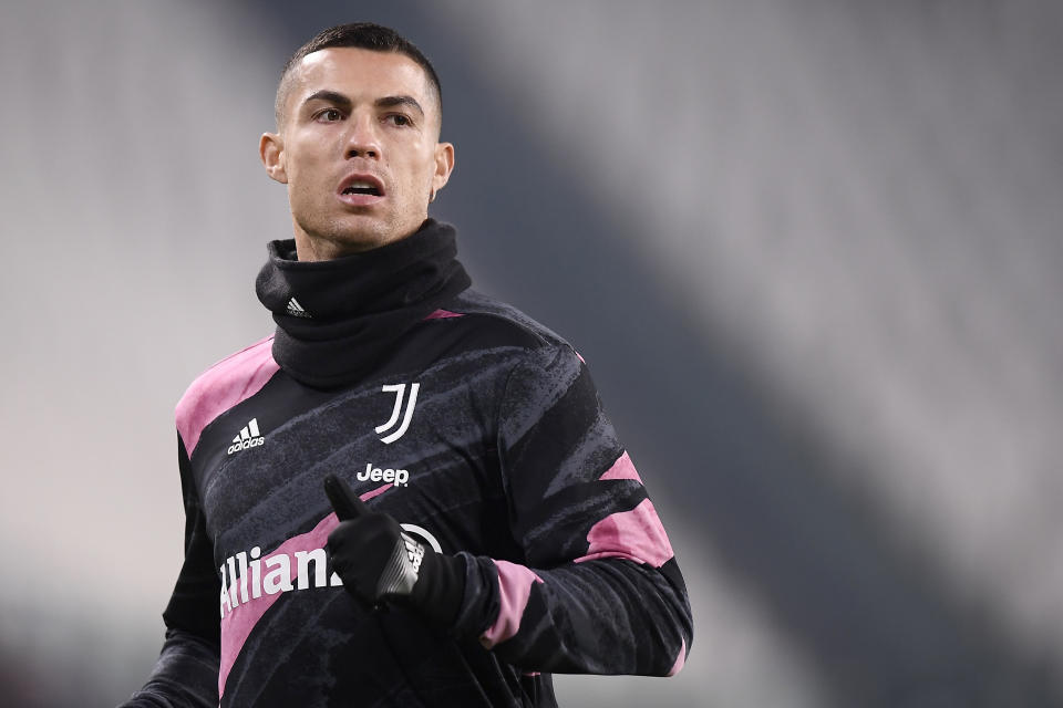 Juventus' Cristiano Ronaldo warms up prior to the Serie A soccer match between Juventus and Fiorentina, at the Allianz Stadium in Turin, Italy, Tuesday, Dec. 22, 2020. (Fabio Ferrari/LaPresse via AP)