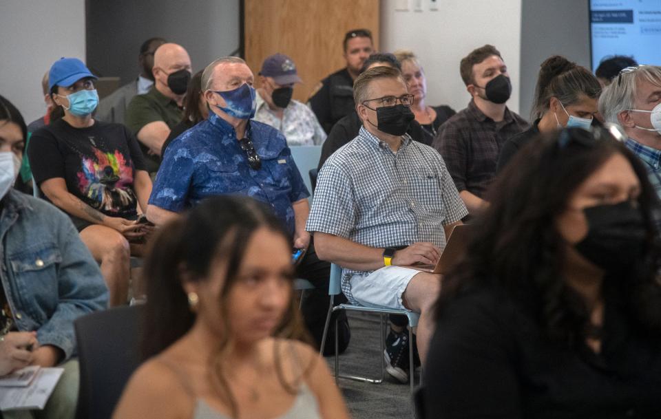 People attend a town hall meeting about the critical grand jury report at the SUSD headquarters in downtown Stockton. 