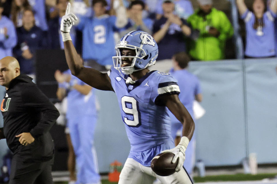 North Carolina wide receiver Devontez Walker (9) celebrates a catch during the second half of the team's NCAA college football game against Miami, Saturday, Oct. 14, 2023, in Chapel Hill, N.C. (AP Photo/Chris Seward)