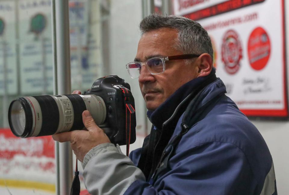 Journal News staff photographer John Meore shooting an ice hockey game at Brewster Ice Arena in Brewster on Saturday, December 4, 2021.