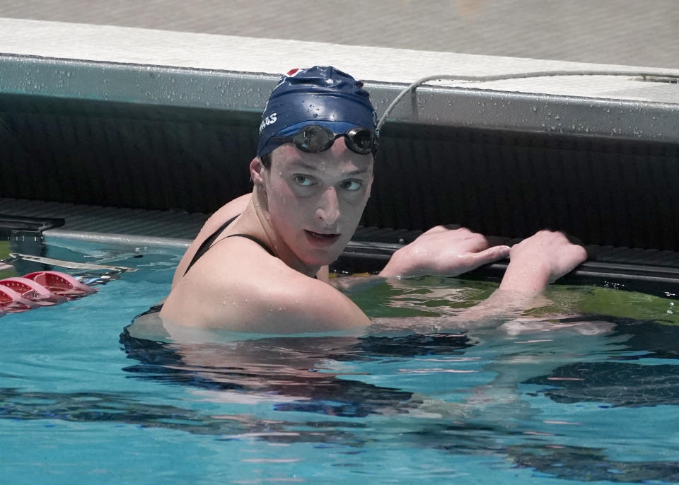 Penn's Lia Thomas looks for a time after swimming in a qualifying heat of the 500 yard freestyle event at the Ivy League Women's Swimming and Diving Championships at Harvard University, Thursday, Feb. 17, 2022, in Cambridge, Mass. Thomas, who is transitioning to female, is swimming for the University of Pennsylvania women's team. (AP Photo/Mary Schwalm)