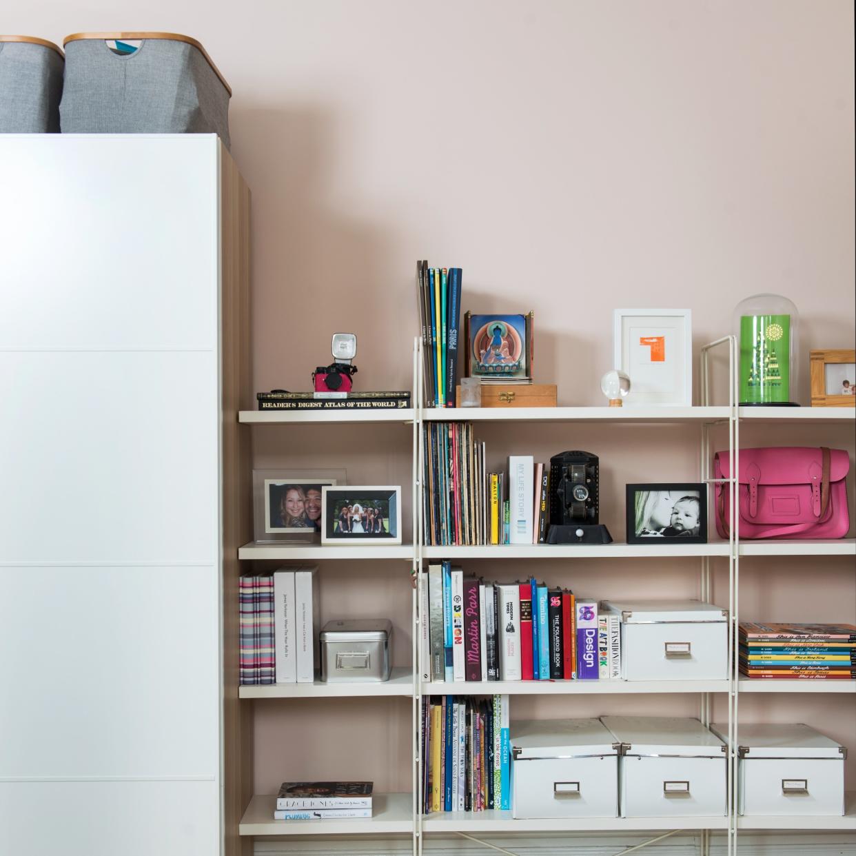  Shelving with books, decor and storage boxes. 