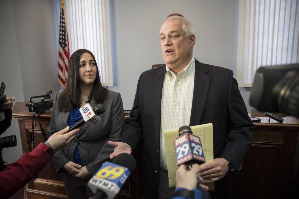 Bucks County District Attorney Matt Weintraub, right, with Chief of Trials of the District Attorney's office, Jennifer Schorn, speaks to the media after Sara Packer's arraignment at District Court in Newtown, Pa., Sunday, Jan. 8, 2017. Packer, whose teenage daughter's dismembered remains were found in the woods last fall, has been charged along with her boyfriend Jacob Sullivan with killing the girl in a "rape-murder fantasy" the couple shared, a prosecutor said Sunday. (Michael Bryant/The Philadelphia Inquirer via AP)