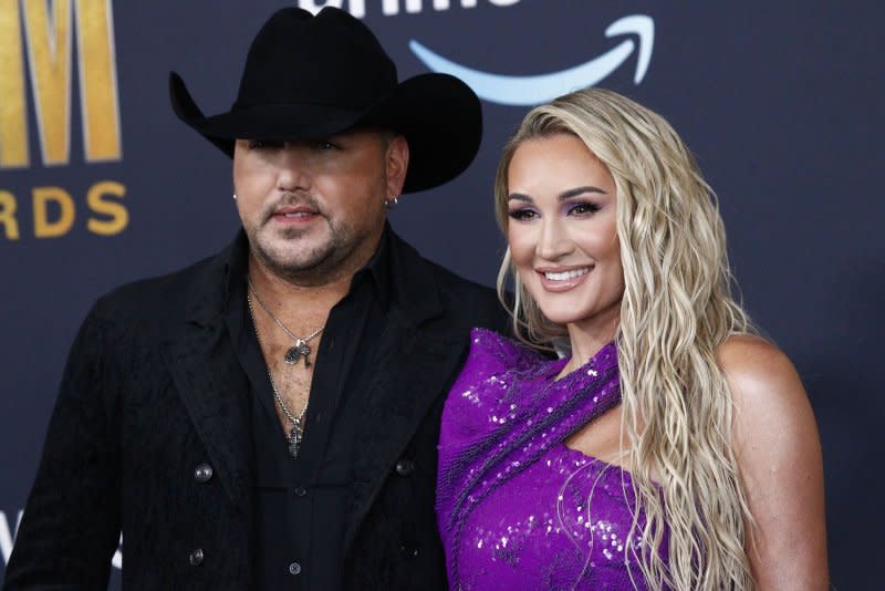 Jason Aldean (L) and Brittany Aldean attend the Academy of Country Music Awards in 2022. File Photo by James Atoa/UPI
