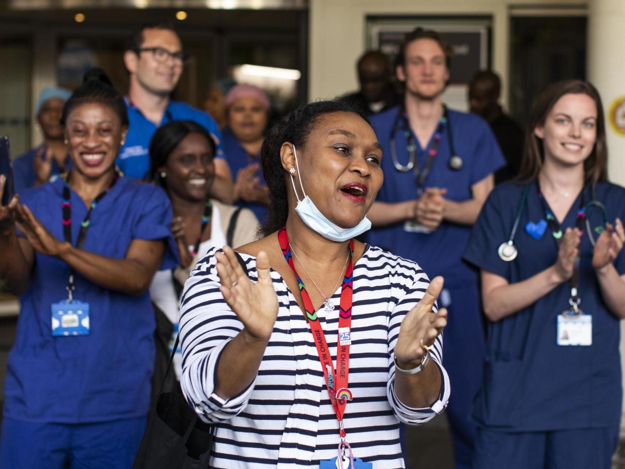 NHS staff and members of the public take part in the weekly 'Clap for Our Carers' event at Chelsea & Westminster Hospital on 28 May 2020 in London, United Kingdom: Photo by Dan Kitwood/Getty Images