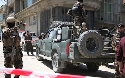 Afghan police officers inspect the scene of the attack - Credit: Haroon Sabawoon/Anadolu Agency/Getty Images