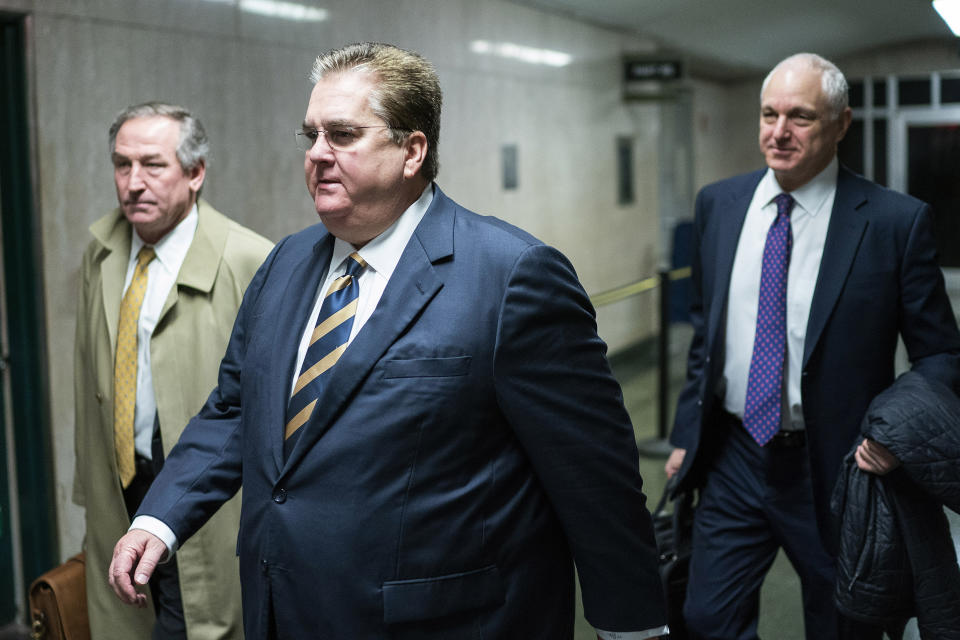 Defense attorneys William Brennan, center and Michael van der Veen, left, and Alan Futerfas exit the courtroom after the sentence day of the Trump Organization tax fraud case, Friday, Jan. 13, 2023, in New York. (AP Photo/Eduardo Munoz Alvarez)