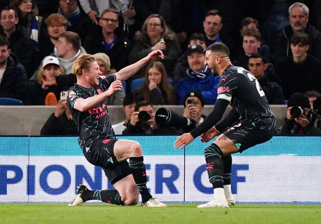 Kevin De Bruyne (left) celebrates the opening goal against Brighton 