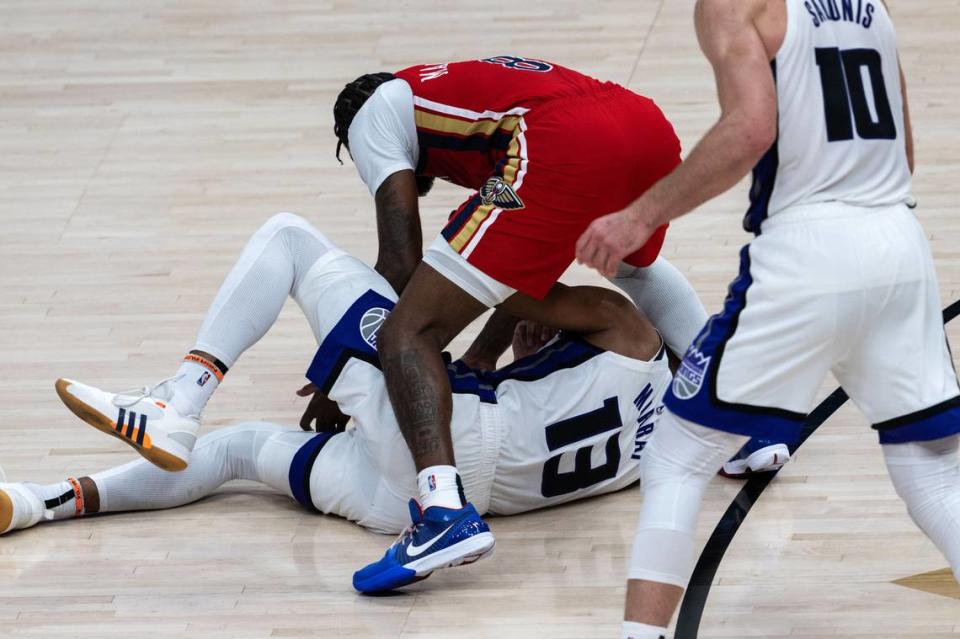 Sacramento Kings forward Keegan Murray (13) loses the ball to New Orleans Pelicans forward Naji Marshall (8) during an NBA play-in game at Smoothie King Center in New Orleans on Friday, April 19, 2024. Hector Amezcua/hamezcua@sacbee.com