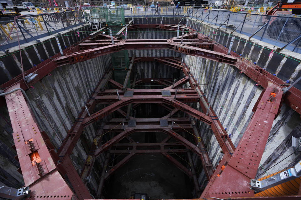 FILE - Workers walk around a construction site for a planned shaft at the Fukushima Daiichi nuclear power plant, run by Tokyo Electric Power Company Holdings (TEPCO), in Futaba town, northeastern Japan, on March 3, 2022. The construction of facilities needed for a planned release of treated radioactive wastewater into the sea next year from the damaged Fukushima nuclear power plant began Thursday, Aug. 4, despite opposition from the local fishing community. (AP Photo/Hiro Komae, File)