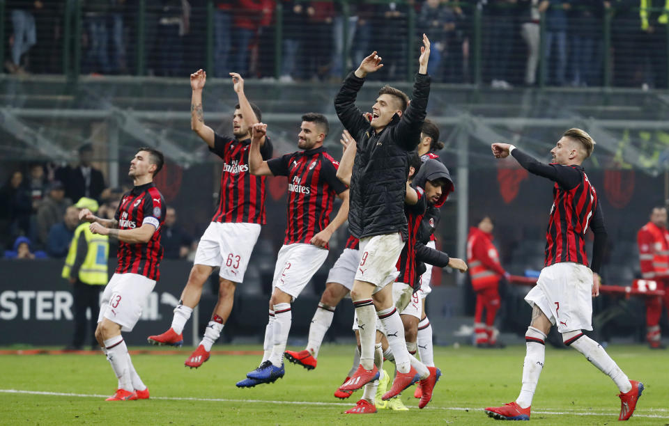 AC Milan players celebrate after winning the Serie A soccer match between AC Milan and Empoli at the San Siro stadium, in Milan, Italy, Friday, Feb. 22, 2019. AC Milan won 3-0. (AP Photo/Antonio Calanni)