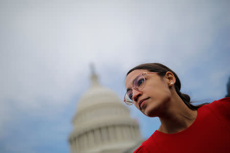 Democratic Representative-elect Alexandria Ocasio-Cortez of New York (L) arrives for a class photo with incoming newly elected members of the U.S. House of Representatives on Capitol Hill in Washington, U.S., November 14, 2018. REUTERS/Carlos Barria