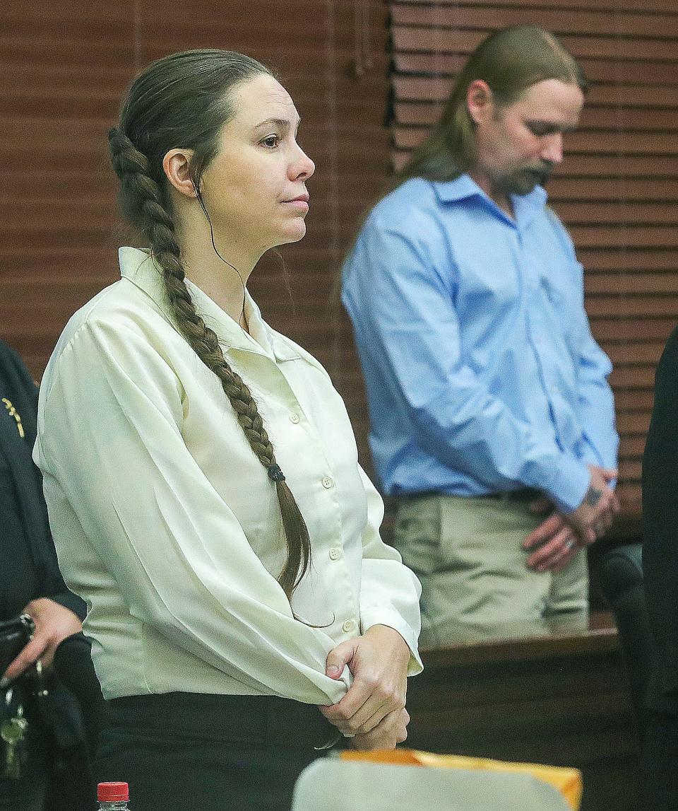 Erica Stefanko and her husband, Mike Stefanko, stand Monday as jurors enter the Summit County Courtroom of Judge Jennifer Towell.