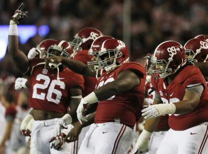 Alabama players celebrate in the closing seconds of the Iron Bowl. (AP)