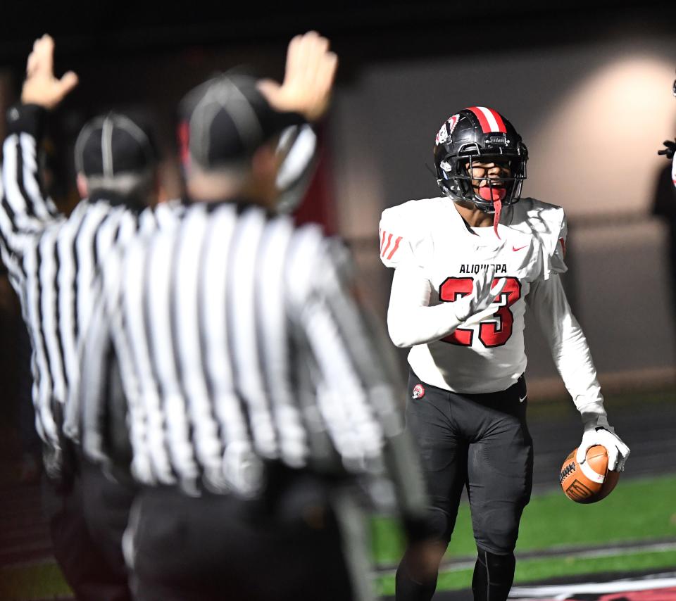 Aliquippa's Tiqwai Hayes celebrates a 37-yard fourth-quarter touchdown run against Jersey Shore during a PIAA Class 4A semifinal at Central Cambria High School in Ebensburg on Friday. Aliquippa won 41-16.