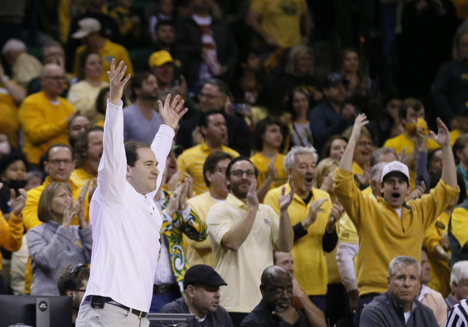 FILE - Baylor coach Scott Drew tries to fire up the crowd during the first half of the team's NCAA college basketball game against Texas on Feb. 12, 2022, in Waco, Texas. Drew goes into his 20th season at fifth-ranked Baylor, which has become a perennial NCAA Tournament contender is the preseason Big 12 favorite after being part of the conference’s last two regular-season titles. (AP Photo/Ray Carlin, File)