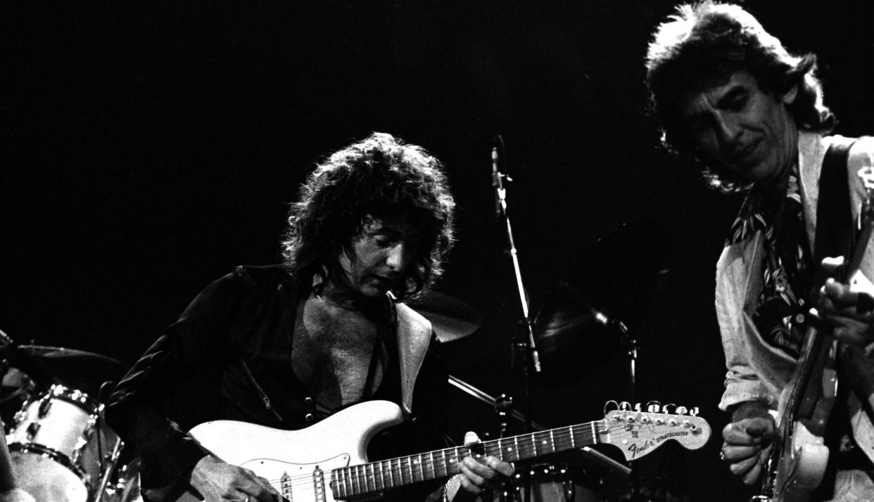  Ritchie Blackmore (left) and George Harrison perform with Deep Purple at the Entertainment Centre in Sydney, Australia on December 12, 1984. 