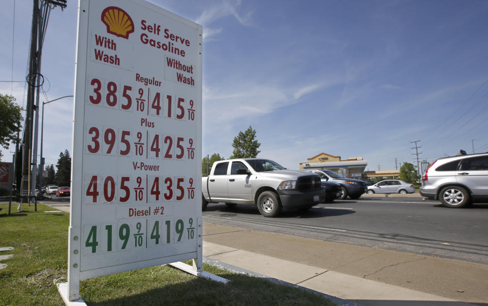 FILE - This April 23, 2019 file photo shows gas prices are displayed at a Shell station in Sacramento, Calif. Four major automakers have reached a secret deal with California to increase gas mileage and greenhouse gas emissions standards, bypassing the Trump administration’s plan to freeze standards at 2021 levels, according to two people briefed on the matter. (AP Photo/Rich Pedroncelli, File)