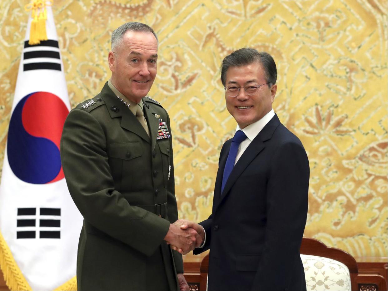 South Korean President Moon Jae-in poses with US Joint Chiefs Chairman General Joseph Dunford for a photo during a meeting at the presidential Blue House in Seoul, South Korea: Bae Jae-man/Yonhap via AP