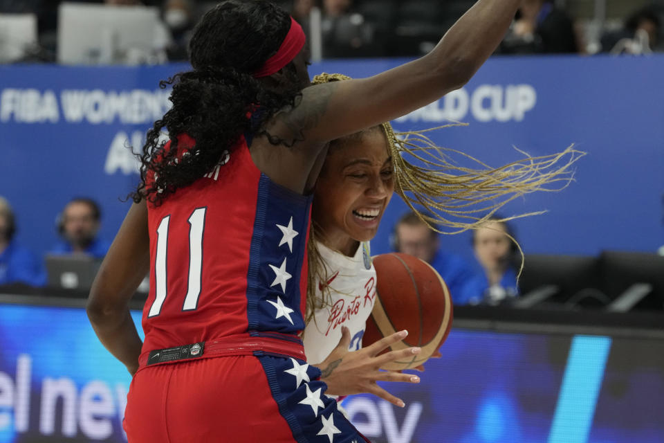 Puerto Rico's Arella Guirantes tries to get past United States' Kahleah Copper at the women's Basketball World Cup in Sydney, Australia, Friday, Sept. 23, 2022. (AP Photo/Mark Baker)