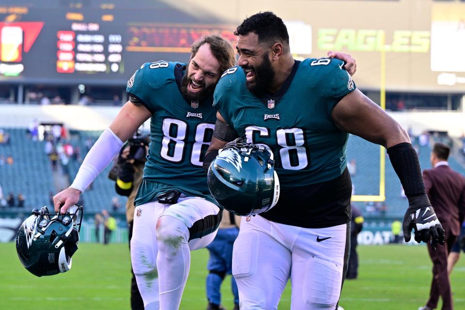 Philadelphia Eagles tight end Dallas Goedert (88) and offensive tackle Jordan Mailata celebrate after their victory over the Pittsburgh Steelers during an NFL football game between the Pittsburgh Steelers and Philadelphia Eagles, Sunday, Oct. 30, 2022, in Philadelphia. The Eagles defeated the Eagles 35-13. (AP Photo/Derik Hamilton)
