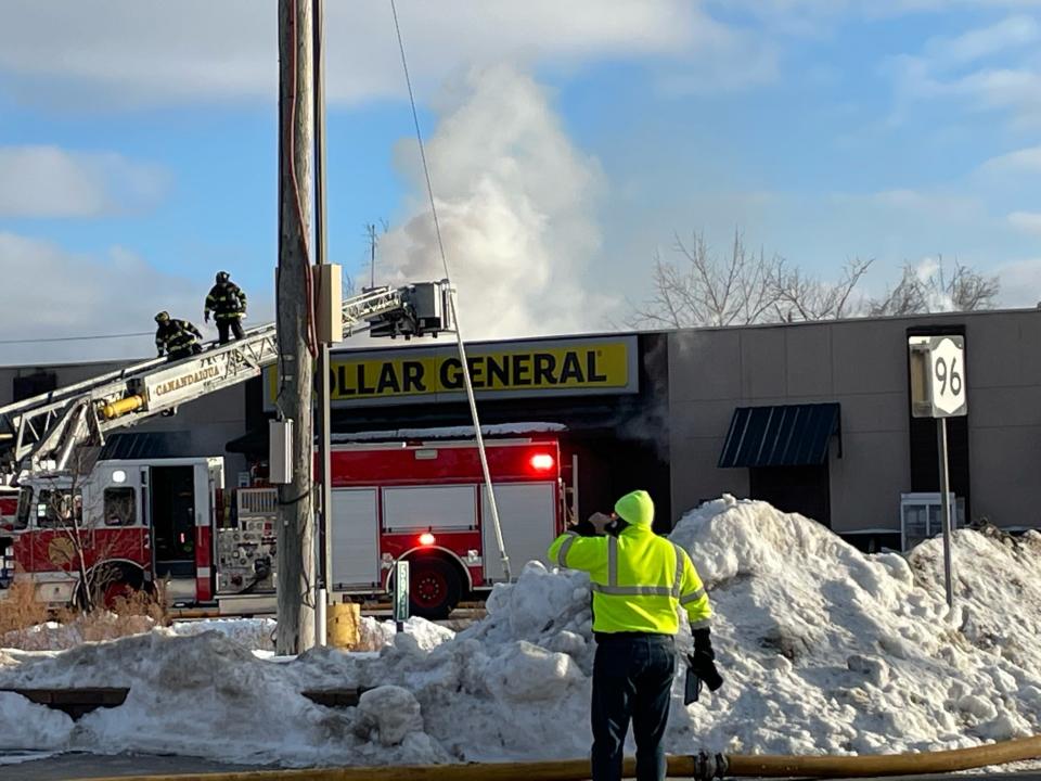 Crews from several fire companies battle a fire at the Dollar General store on state Route 96 in Farmington on Thursday afternoon.