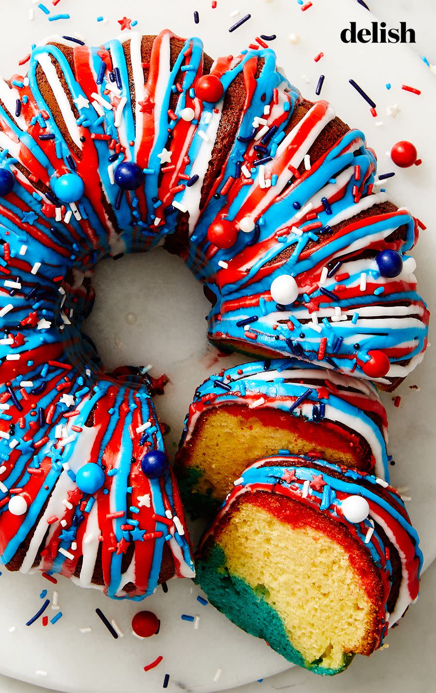 <p>For a blast of flavor and color, our spin on the classic firecracker cake upgrades itself from white cake to a tangy lemon batter with blueberry- and strawberry-flavored swirls on the inside. On the outside, we split a simple glaze into multiple colors, and went wild with decorating to match <a href="https://www.delish.com/4th-july-recipes/" rel="nofollow noopener" target="_blank" data-ylk="slk:4th of July;elm:context_link;itc:0;sec:content-canvas" class="link ">4th of July </a>fireworks.</p><p>Get the <a href="https://www.delish.com/cooking/recipe-ideas/a40253492/lemon-berry-firecracker-cake-recipe/" rel="nofollow noopener" target="_blank" data-ylk="slk:Lemon-Berry Firecracker Cake recipe;elm:context_link;itc:0;sec:content-canvas" class="link "><strong>Lemon-Berry Firecracker Cake recipe</strong></a>.</p>